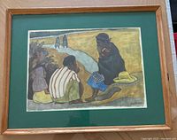 Photo of the framed print showing the full artwork and wood frame with green mat board