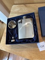 Swallow stainless steel flask set in blue lined box, including flask, cup, and funnel.