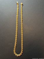 Full view of the 16-inch box-link gold chain on dark background