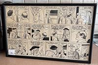 Full view of the framed Micky Finn comic strip print hung or placed for display, showing multiple panels with characters talking in a theatre setting.