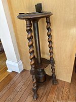 Full view of the oak barley twist three-legged ashtray stand featuring a copper pipe insert and glass jar at base.