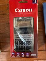 Canon P1-DHV calculator in original red sealed packaging