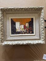 Full frontal view of framed oil painting