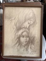 Full view of the framed print showing the mother and child artwork and overall condition.