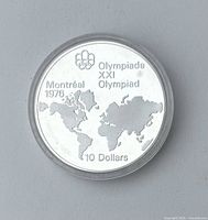 Front side of the silver coin featuring the world map, Montreal 1976 Olympics logo, and denomination $10.