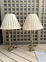 Pair of lamps full view on deck flooring