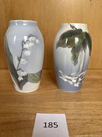 Pair of Royal Copenhagen bud vases front view, showing both floral designs.