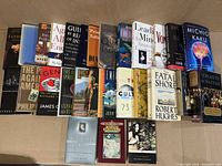 Image of 27 nonfiction books laid out in two row stacks, titles including science, philosophy, and social themes.