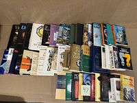 Books arranged in three rows showing variety of titles and conditions.