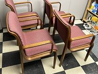 Four Bill Stephens for Knoll Brentwood chairs arranged in a group, showing wood frames and mauve seats with armrests