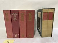 Photo showing the spines of the 6 hardcover history books by Page Smith, including 4 volumes of History of the United States and 2 volumes of John Adams, along with their slipcases.