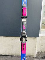 Full length photo of Atomic ARC SL Powerflex ski showing pink V.A.R branding and blue/purple design.