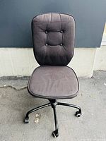 Front view of office recliner chair showing faded jean blue fabric upholstery, button-tufted backrest with four buttons, and cushioned seat.
