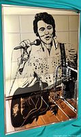 Elvis Presley mirrored wall art showing full portrait with guitar and microphone.