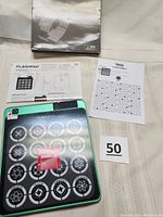 Flashpad Infinite game box and contents including instruction sheet and electronic game board.