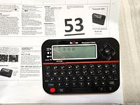 RecZone Model 595 Password Safe with user manual showing front of device with QWERTY keyboard, screen, and buttons.