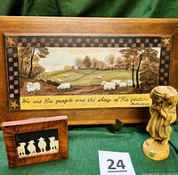 Photo showing all three items in the lot: the shepherd figurine, the painted wooden picture, and the framed Scherenschnitte paper cutting.