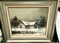 Framed canvas print of winter snow scene with barn and pine trees, signed by artist Barrister