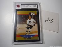 First graded Gordie Howe hockey card showing player in Hartford Whalers uniform, card graded 9.5 by NGM in protective casing.