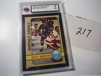 Front photo of the graded hockey card displaying Rick Martin skating in Buffalo Sabres uniform.