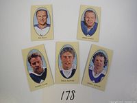 Five NHL mini trading cards arranged in two rows showing players Red Kelly, Johnny Bower, Wendel Clark, Borje Salming, and Darryl Sittler.
