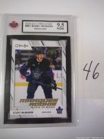 Front view of 2023-24 O-Pee-Chee Bobby McMann rookie hockey card graded 9.5 by NGM in clear protective slab.