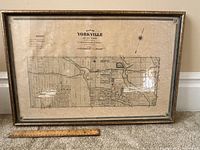 Full front view of framed map with ruler at base