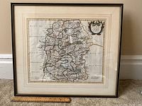 Full view of antique framed map depicting Wiltshire, England with ruler for scale.
