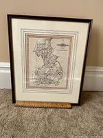 Full view of framed engraved map of Cambridgeshire with ruler showing size