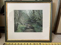 Full view of framed tempura painting depicting a wooded path scene.
