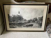 Front view of the full framed black and white print, with visible canal boats and architecture.