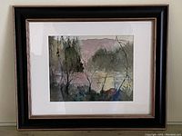 Framed watercolour painting of natural landscape with black frame and white mat.