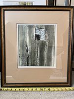 Framed watercolour painting showing the full artwork and frame with measuring tape indicating 17 inches height.