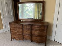 Full front view of the vintage wooden dresser with detachable mirror on top, showing the overall style and condition.