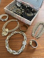 Full view of all jewelry pieces including box with earrings