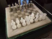 Full view of onyx chess board with all pieces set up