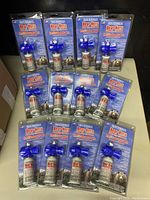 Twelve packaged Frontiersman Bear Horns arranged on a surface showing all packaged components.