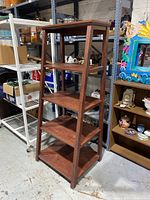 Front-left angle view of the 5 tier wooden ladder shelf showing all five shelves and the wood grain finish.