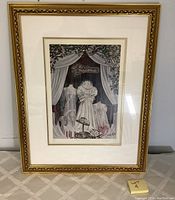 Front view of framed limited edition art print "Orchids and Pearls." Gold-tone decorative frame, white mat border, print showing Victorian dresses and flowers.