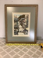 Front view of the framed city street art print measuring about 18x15 inches.