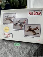Box front showing images of the three included T-33 model planes: Golden Hawks, Thunderbirds, Golden Centennaires, with Pro Scale branding and scale of 1:72.