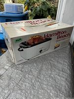 Photo of Hamilton Beach roaster oven box showing product image and brand name.