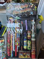 Mixed fireworks set with various sticks including Bengal Fire Red and Green, and other colorful items in original packaging.