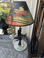 Full view of Scarface themed table lamp showing the printed lampshade with movie imagery and logo.