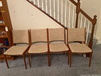 Four chairs in a row showing front view