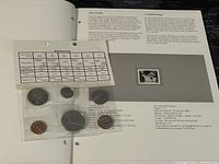 Photo showing the 1980 Canadian proof-like coin set in a plastic holder accompanied by a specifications sheet on the coin details.