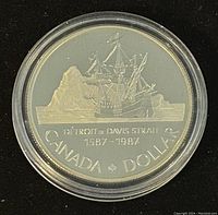 Reverse side showing ship and iceberg design with commemorative markings.