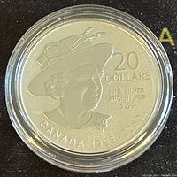 Front side of the 2012 Canadian $20 Silver Diamond Jubilee coin showing Queen Elizabeth II wearing a hat, $20 denomination, and purity markings.