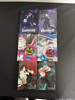 Top view of the six softcover manga books showing front covers and titles.