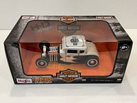 Front side of the Maisto 1/24 Harley Davidson 1929 Ford Model A die-cast model in original box.